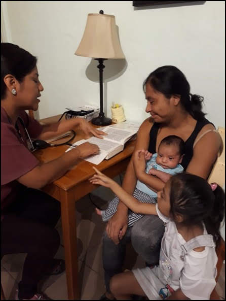 Sara Consults with Mom and Baby